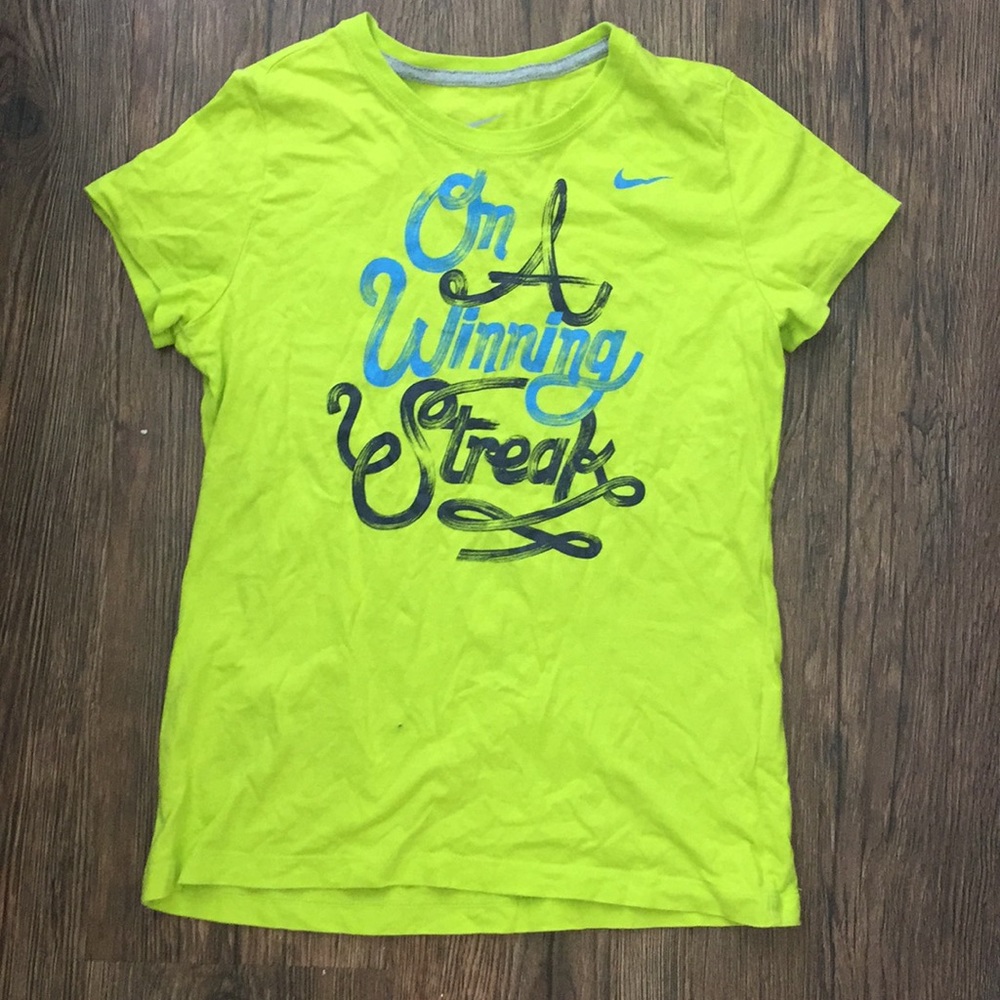 Neon green girls’ nike shirt.